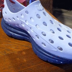 Perforated White Slip-On Shoes with Blue Sole